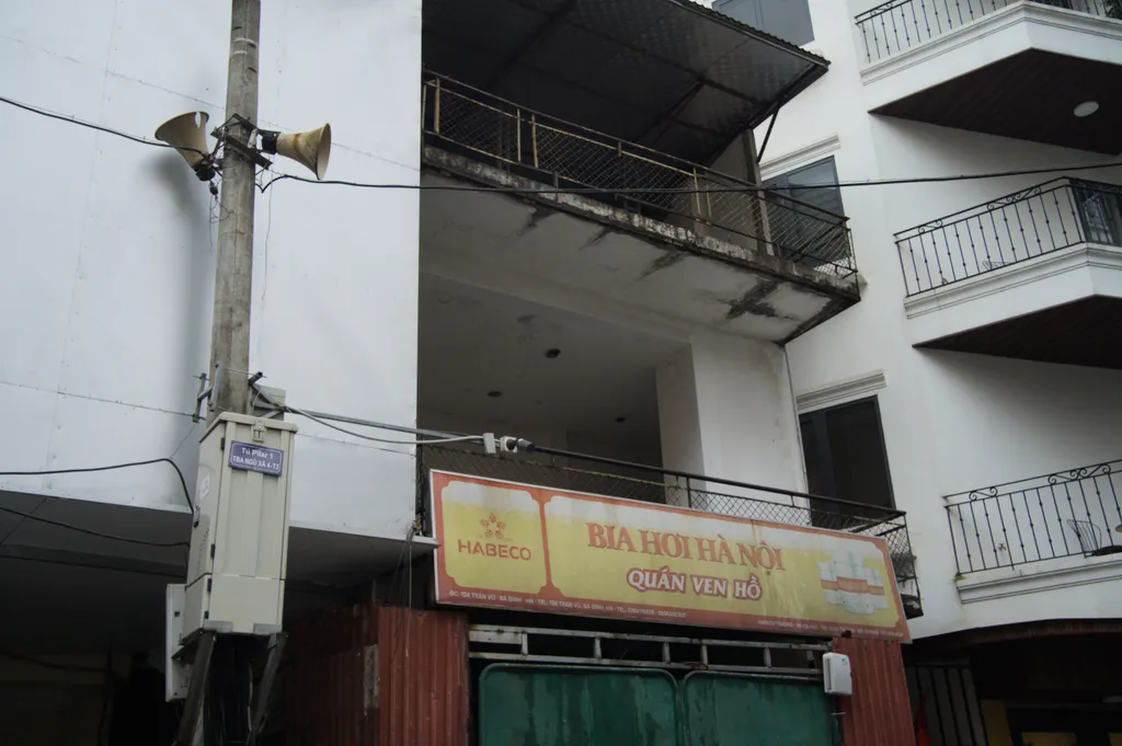 'Bia Hoi' next to a megaphone on a post
